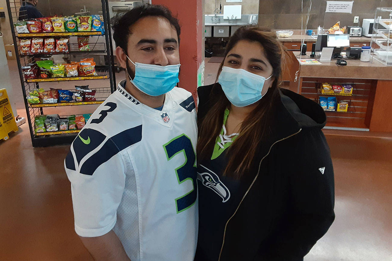 Kuljit Singh and wife Malika celebrated the grand opening Dhotson's grocery at the site of the former Lea Hill Market last Wednesday. Photo by Robert Whale, Auburn Reporter.