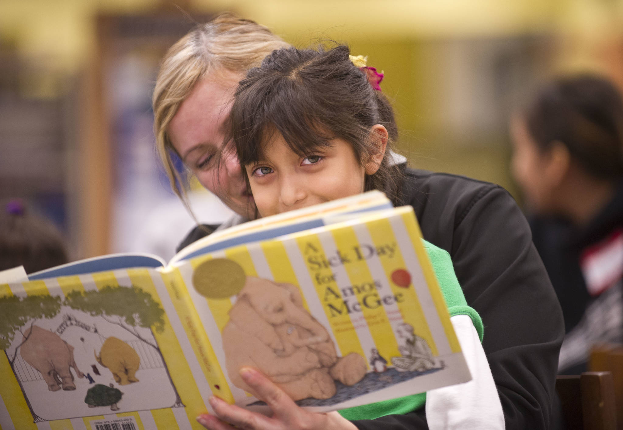 Youngsters enjoy reading in Humanities for Washington’s Cabin Fever program. Courtesy photo