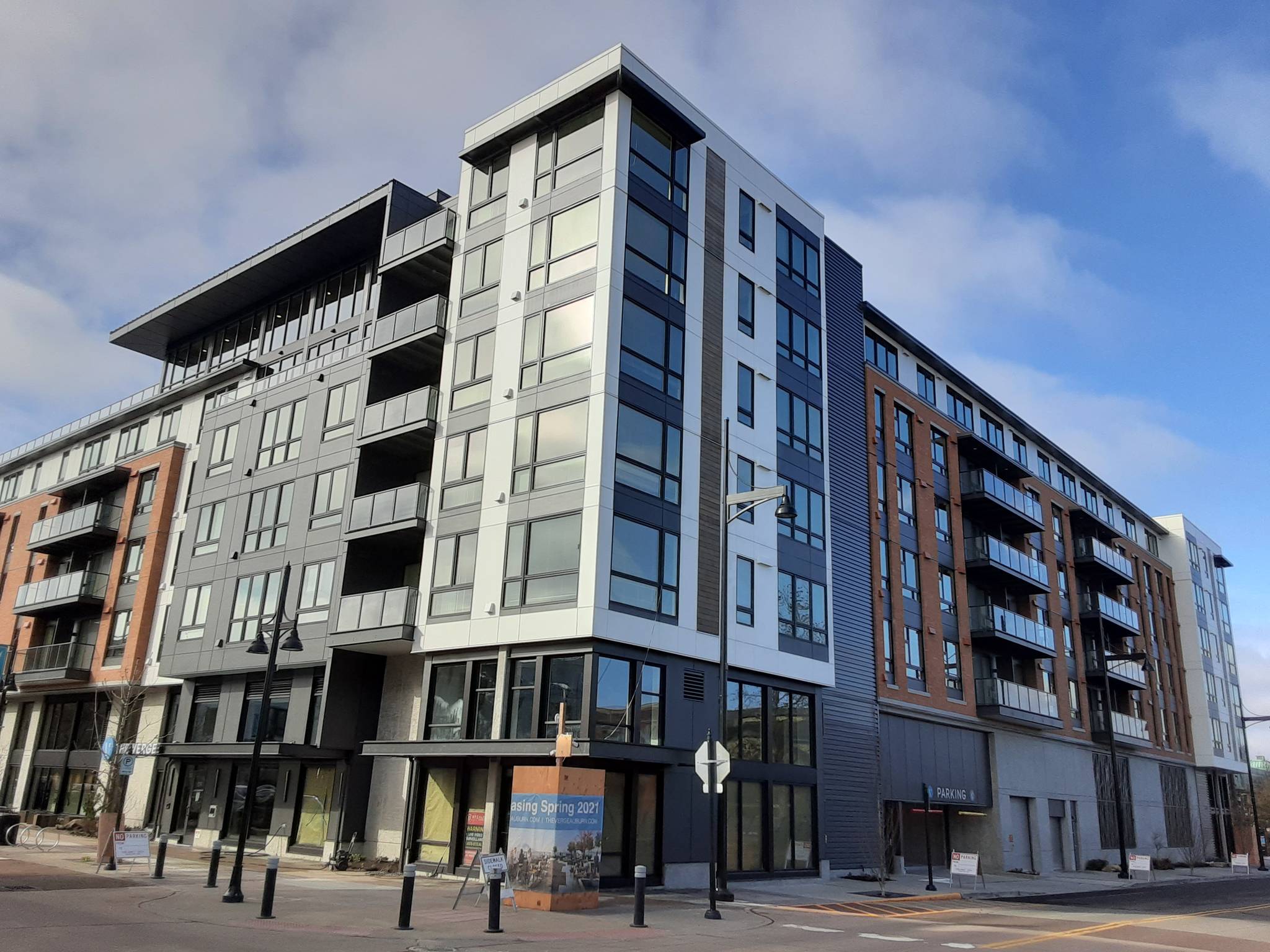 The 7-story apartment building Teutsch Partners LLC has been at work on for Seattle-based NW Holdings for the last two years is nearing completion at 1st Street Southeast and South Division Street. The owners are set to begin leasing apartments this spring. Robert Whale/Auburn Reporter.