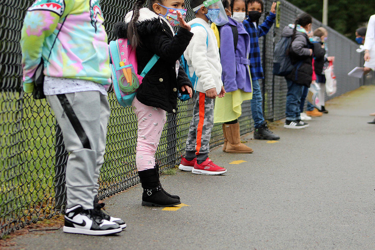 Kindergarten and first grade students line up outside of Panther Lake Elementary in Federal Way on March 15. Olivia Sullivan/the Mirror