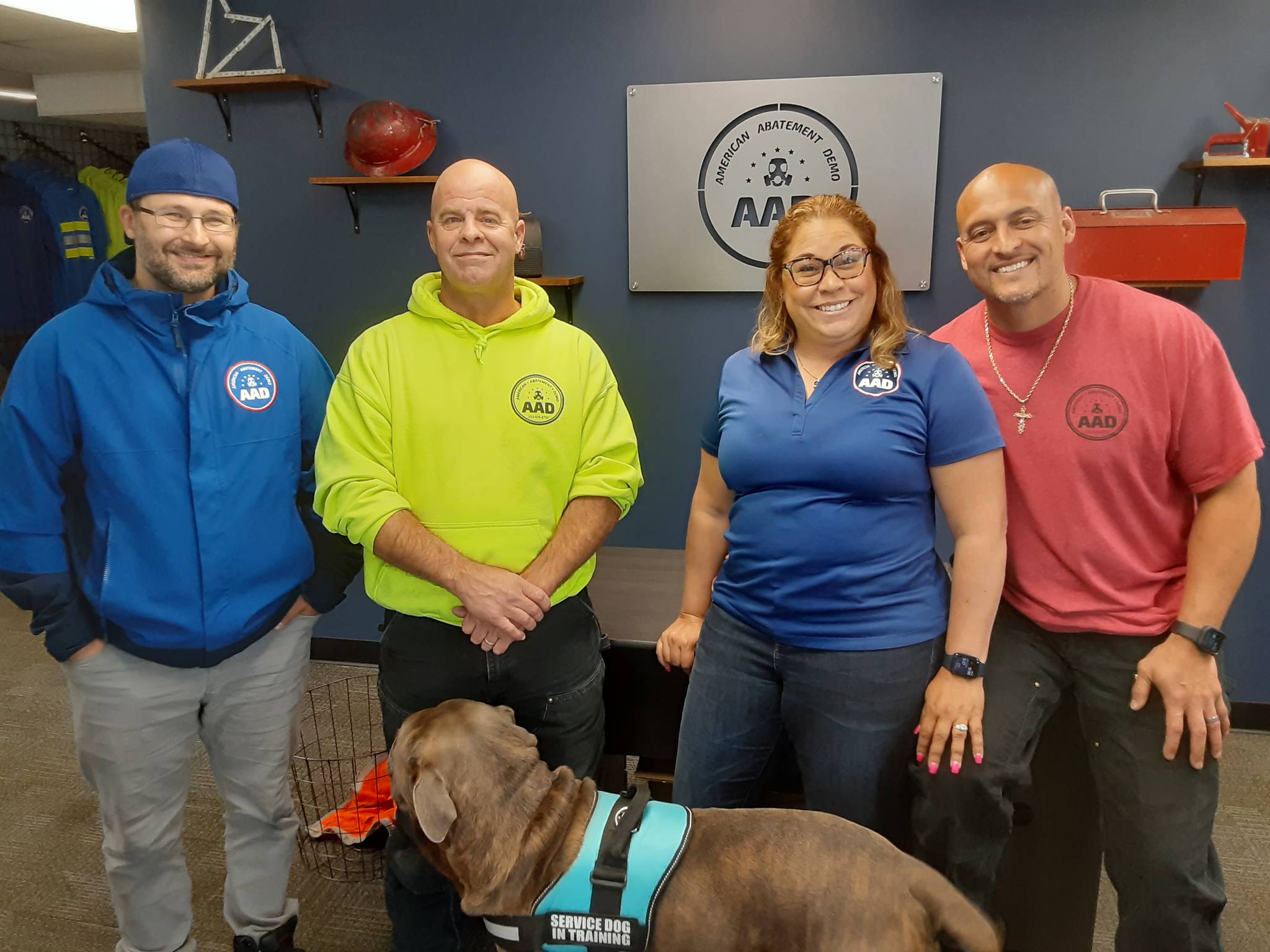 Mari Borrero and to the right, husband, Aaron, flanked by a handful of staff and employees. Robert Whale, Auburn Reporter