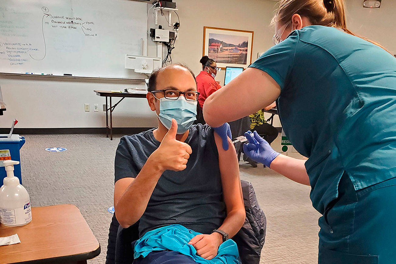 Dr. Amit Desai of St. Francis Hospital in Federal Way receives a COVID-19 vaccine on Dec. 17, 2020. Photo courtesy of CHI Franciscan