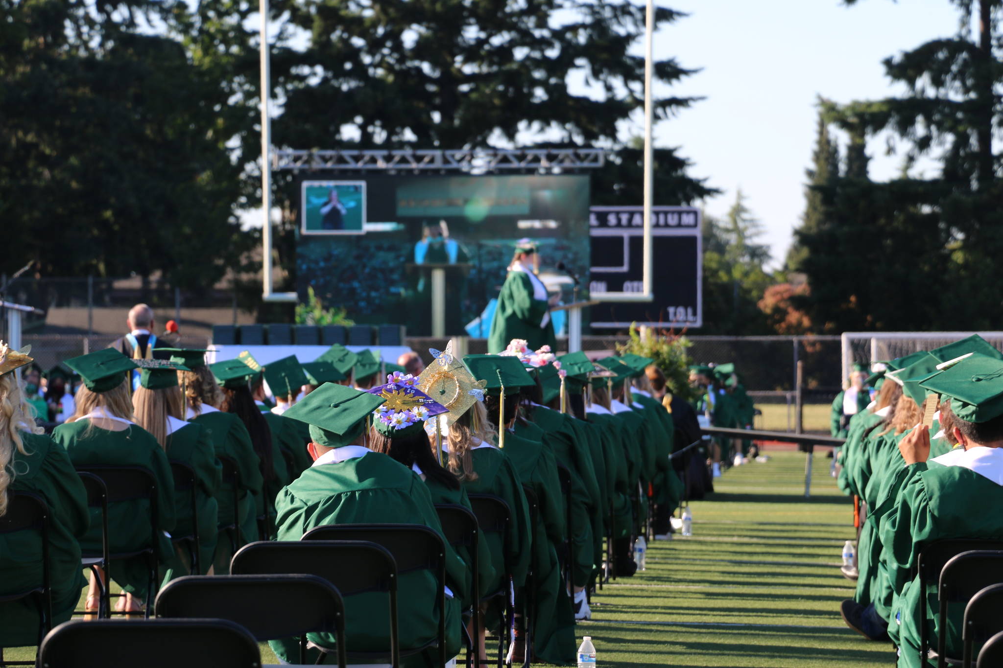 Auburn High School graduates-to-be listen as their class speaker addresses them during Saturday’s graduation ceremony at Veterans Memorial Stadium. Courtesy photo.