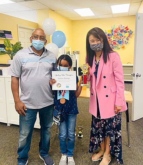 A spelling bee winner poses with her award. Courtesy photo