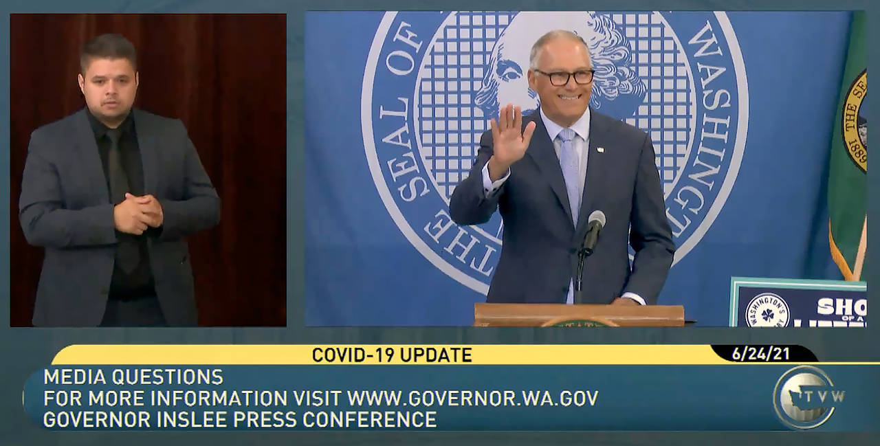 Gov. Jay Inslee waves during his Thursday morning press conference on extending protections for renters. (TVW)
Gov. Jay Inslee waves during his Thursday morning press conference on extending protections for renters. (TVW)