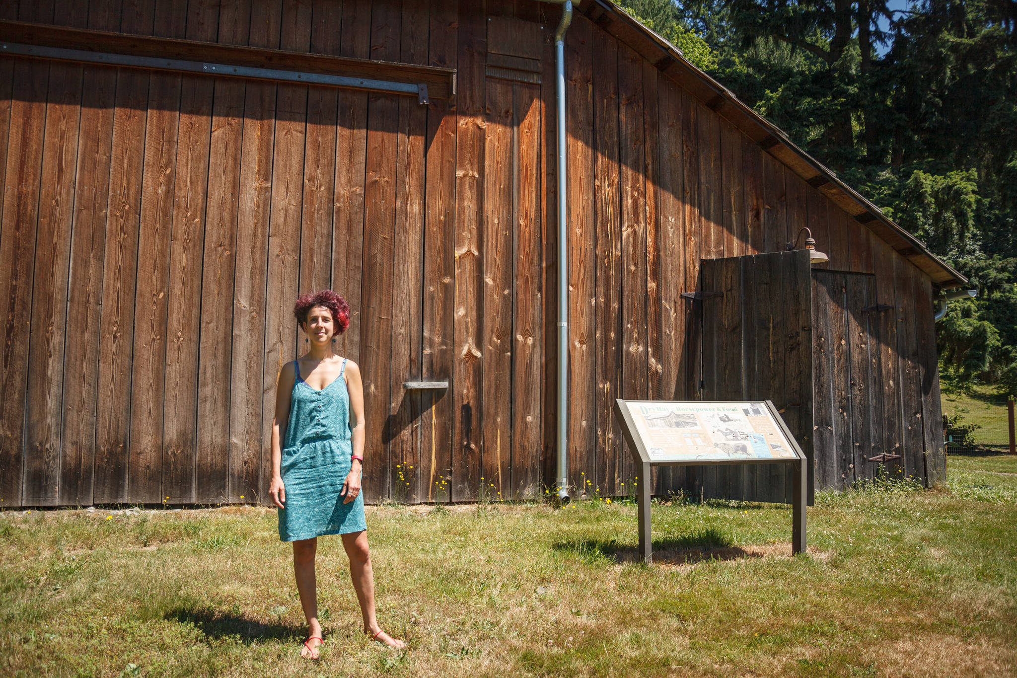 Artist in residence Neely Goniodsky poses for a photo outside of the barn she is working out of at Mary Olson Farm on Friday, June 25, 2021. The farm is located at 28728 Green River Road. Photo By Henry Stewart-Wood/Auburn Reporter
