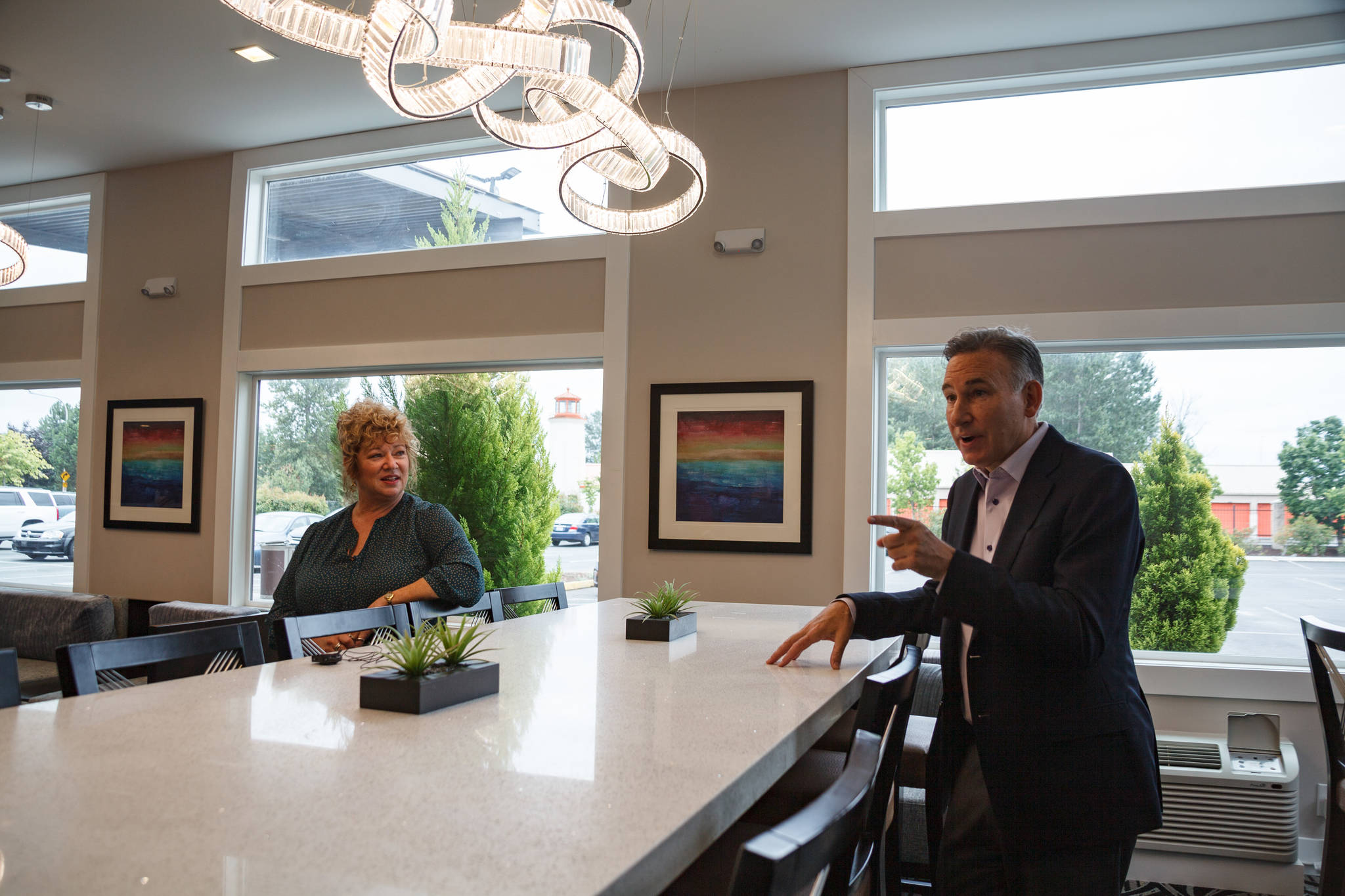 King County Executive Dow Constantine and Auburn Mayor Nancy Backus discuss the plans for the Clarion Hotel in Auburn on Tuesday July 20. The hotel will be used to house approximately 100 people experiencing homelessness in the area as part of the county’s Health Through Housing program. Photo by Henry Stewart-Wood.