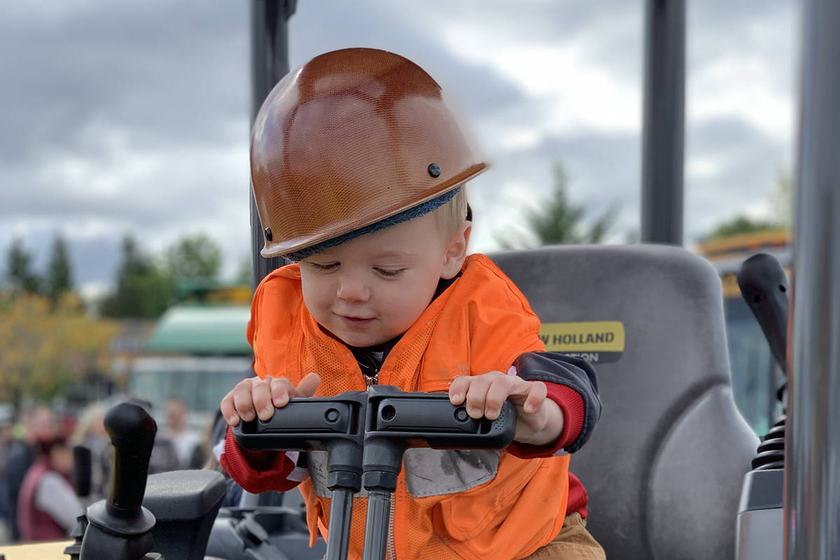 Trying it on for size! Touch a Truck is all about exploring.