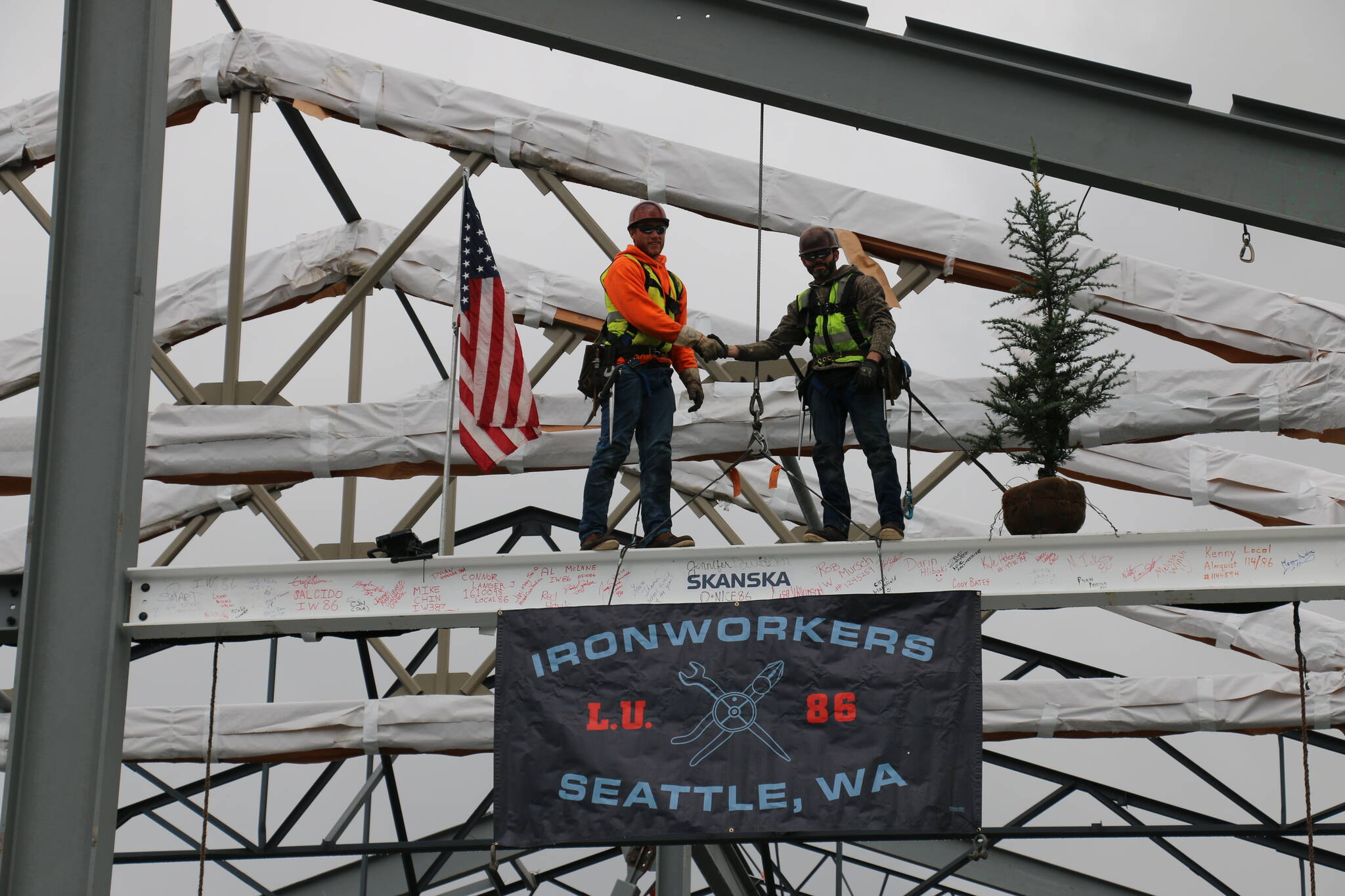 Iron workers from Ironworkers Local 82, Seattle, set the last beam on the rebuild of Chinook Elementary School. Vicki Alonzo, Auburn School District.