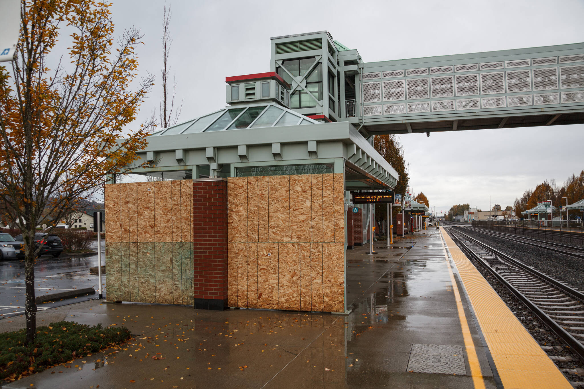 Broken windows boarded up at Sound Transit Auburn Station after a man threw rocks at the windows, shattering them and causing an estimated $20,000 in damage according to charging documents. Photo by Henry Stewart-Wood/Auburn Reporter