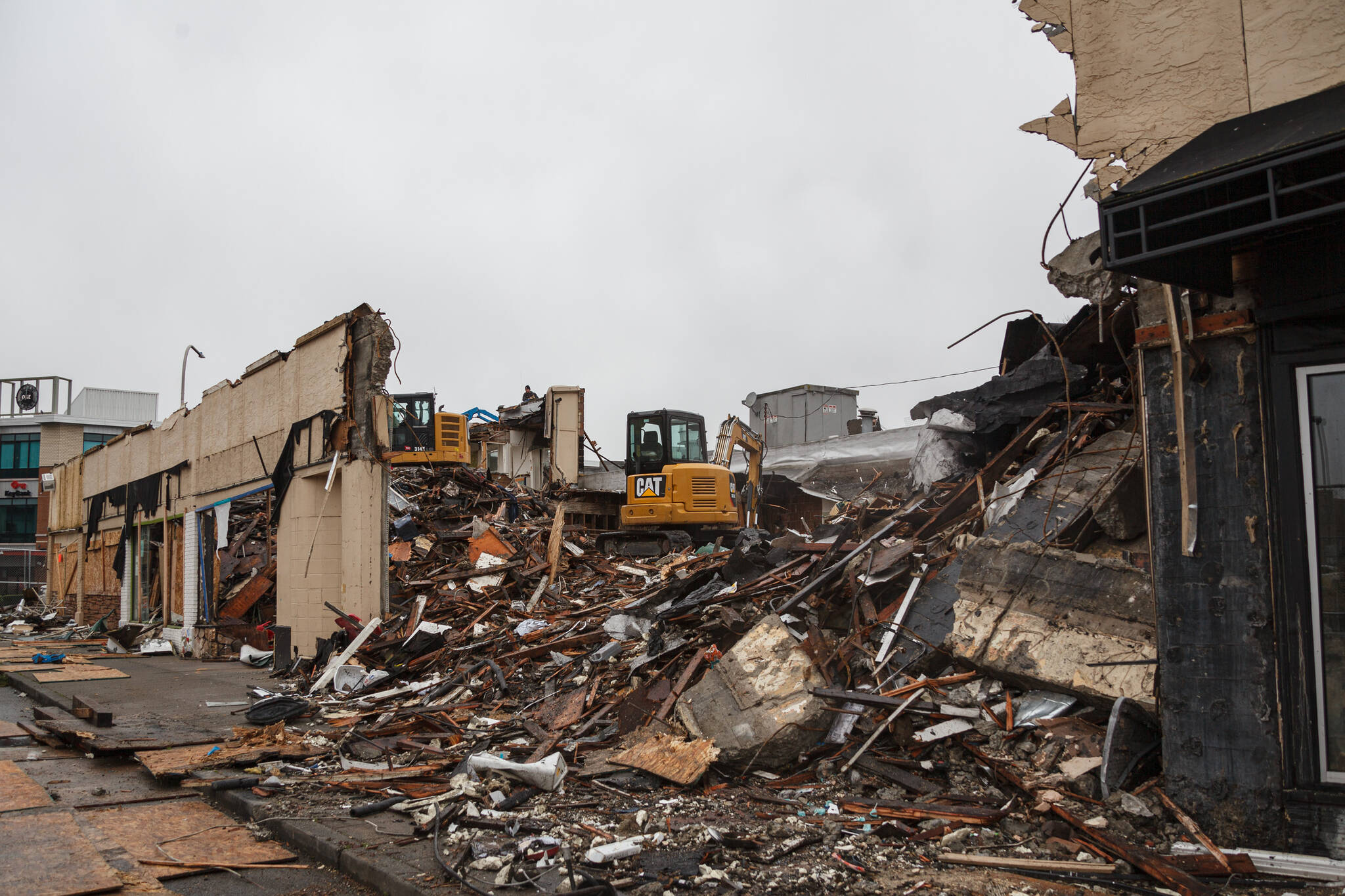 Excavators demolish the Max House Apartments complex in downtown Auburn on Wednesday, Dec. 15. Photo by Henry Stewart-Wood/Sound Publishing