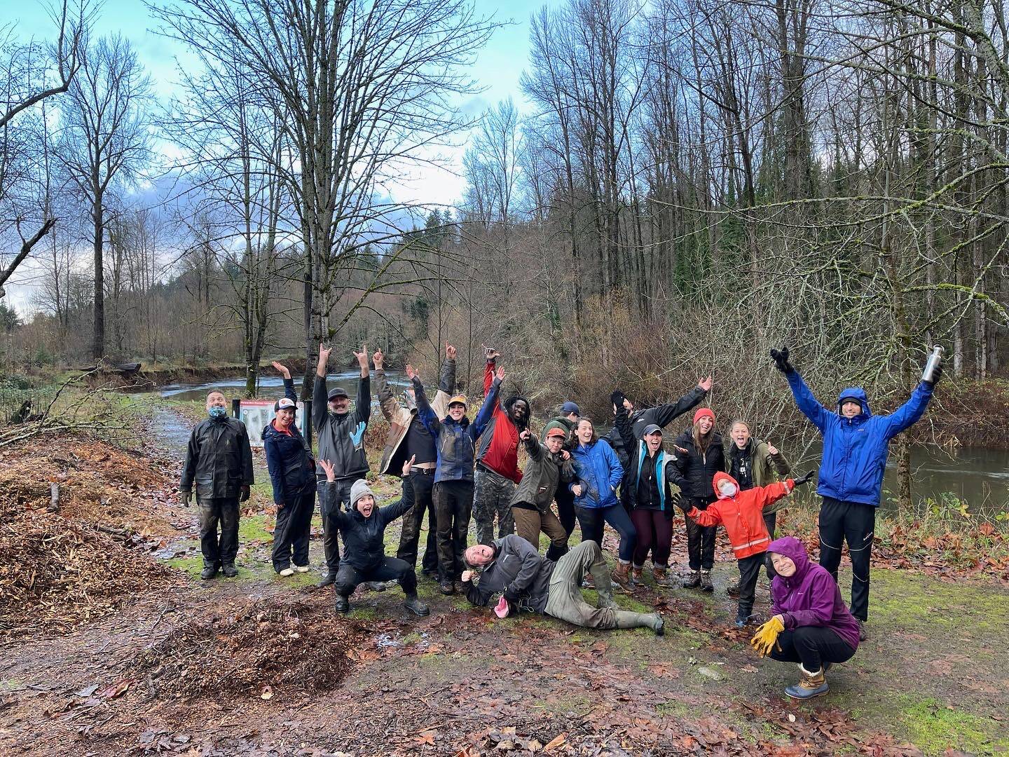 Volunteers on an earlier work crew express exuberance after finishing the job. Photo courtesy Erik Ribaux