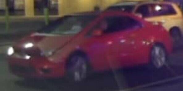 Auburn Police are looking for a suspect in the shootings Feb. 25 at the Memo’s restaurant on Auburn Way North. Video caught this image of a red Honda Civic two-door with the driver side headlight out leaving the scene, which may or may not be connected to the actual shootings. The vehicle may have decals on the windows. Courtesy photo, Auburn Police Department.