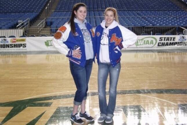 Cait Carr, left, and Aly (Carr) Lacey pose for a photo in their varsity jackets. The sisters played together at Auburn Mountainview High School, but now coach girls basketball at Auburn Mountainview and Kentlake High School, respectively. COURTESY PHOTO, Marla Carr