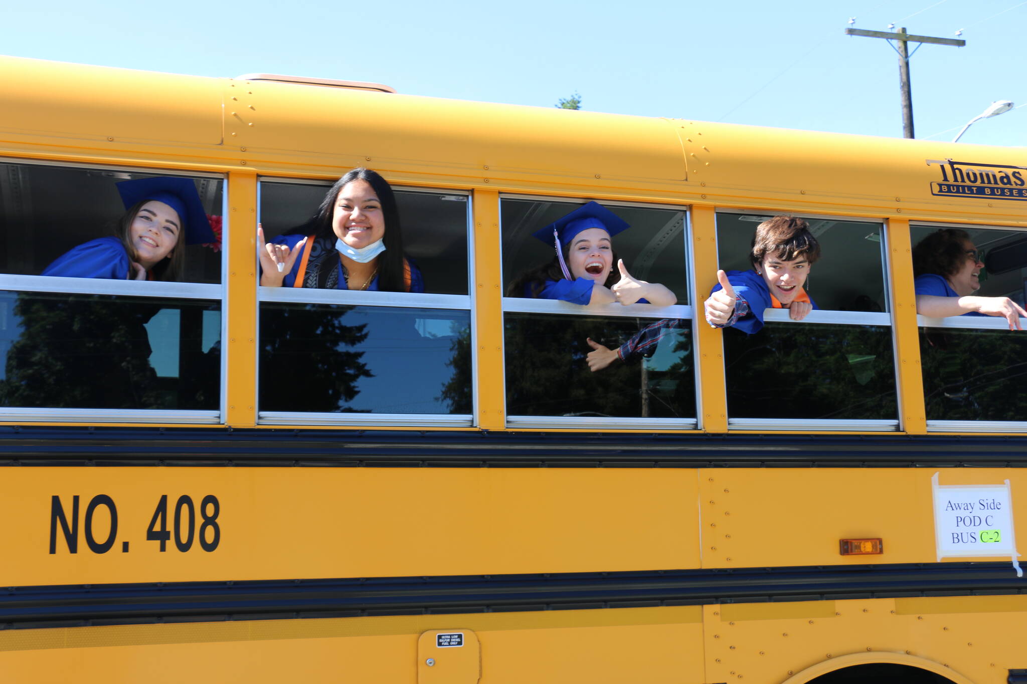 In this 2021 file photo, Auburn Mountainview High School graduates are all smiles on the buses taking them to their graduation ceremonies. Courtesy photo