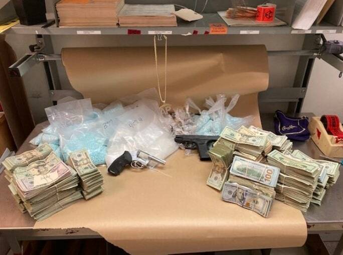 Auburn Police say they seized 82,400 Fentanyl pills, 1.8 lbs heroin, 3.8 pounds of methamphetamine, $173,138 in US currency and two firearms from a Kent apartment on the afternoon of April 20 and arrested its 32-year-old tenant. Auburn Police photo