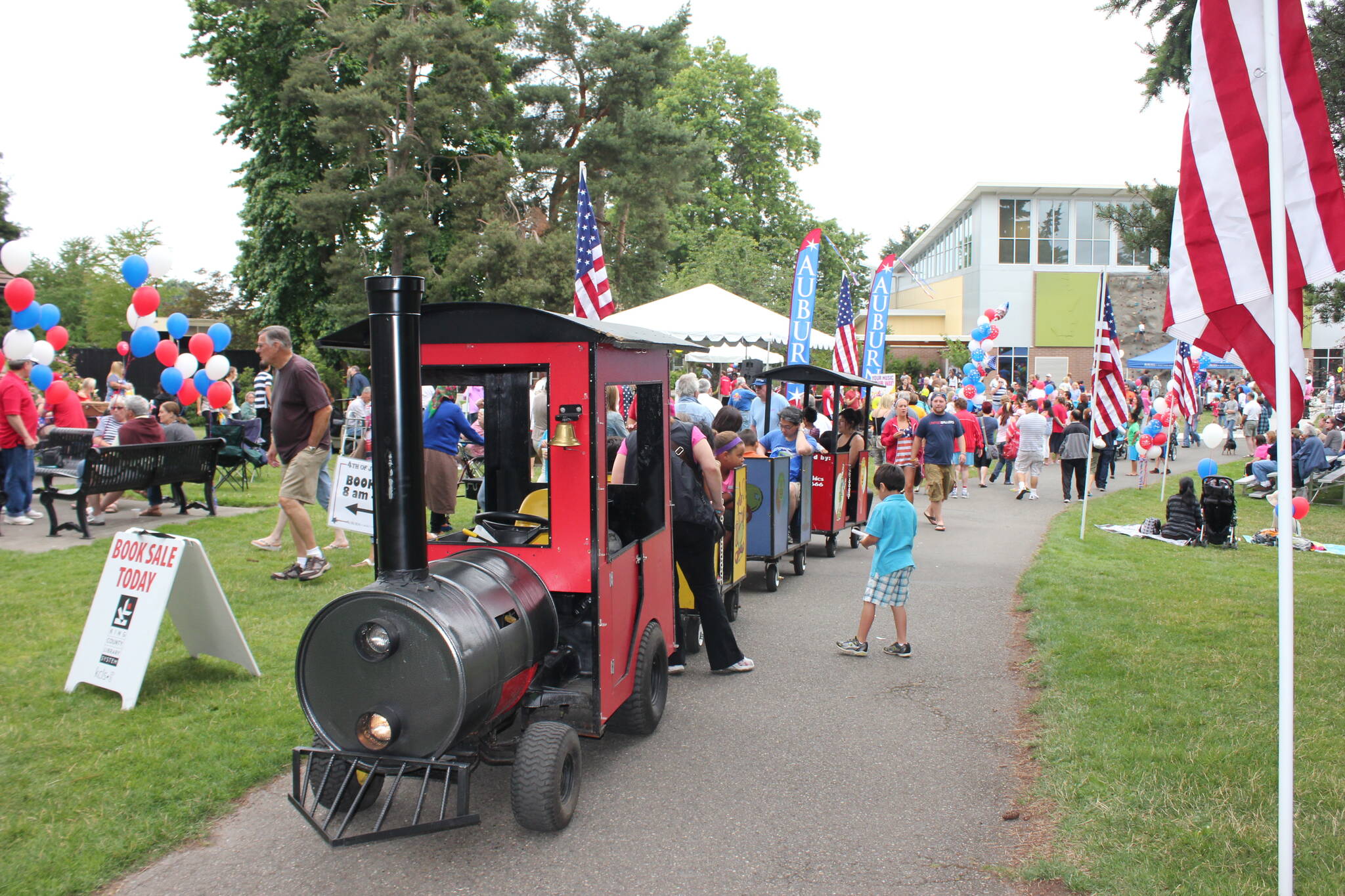 Photo courtesy of the City of Auburn
A trackless train gives kids a ride through the park at one of Auburn’s previous Fourth of July Festivals.