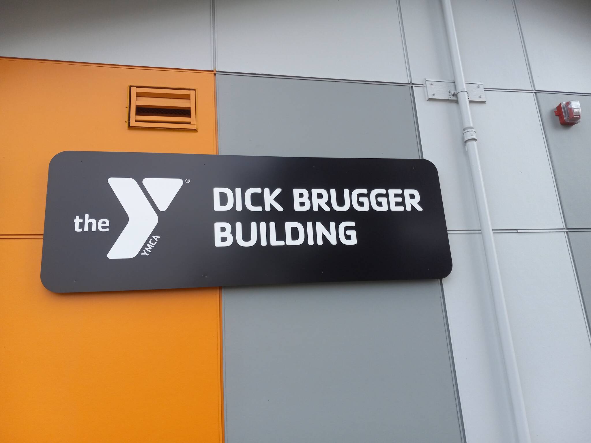 The former L-building at the Y Social Impact Center now bears the name of Dick Brugger, who charted the course for Auburn Resource Center. Photo by Robert Whale, Auburn Reporter
