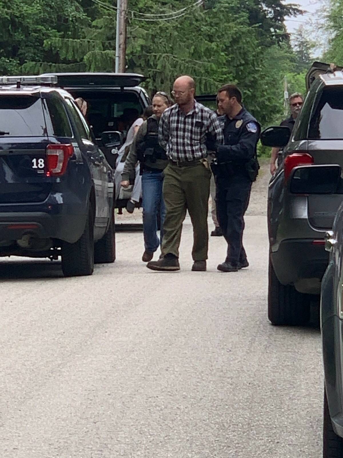 Oak Harbor Police Department photo
Officers arrest Tyler Dinsmoor at his home Friday morning.