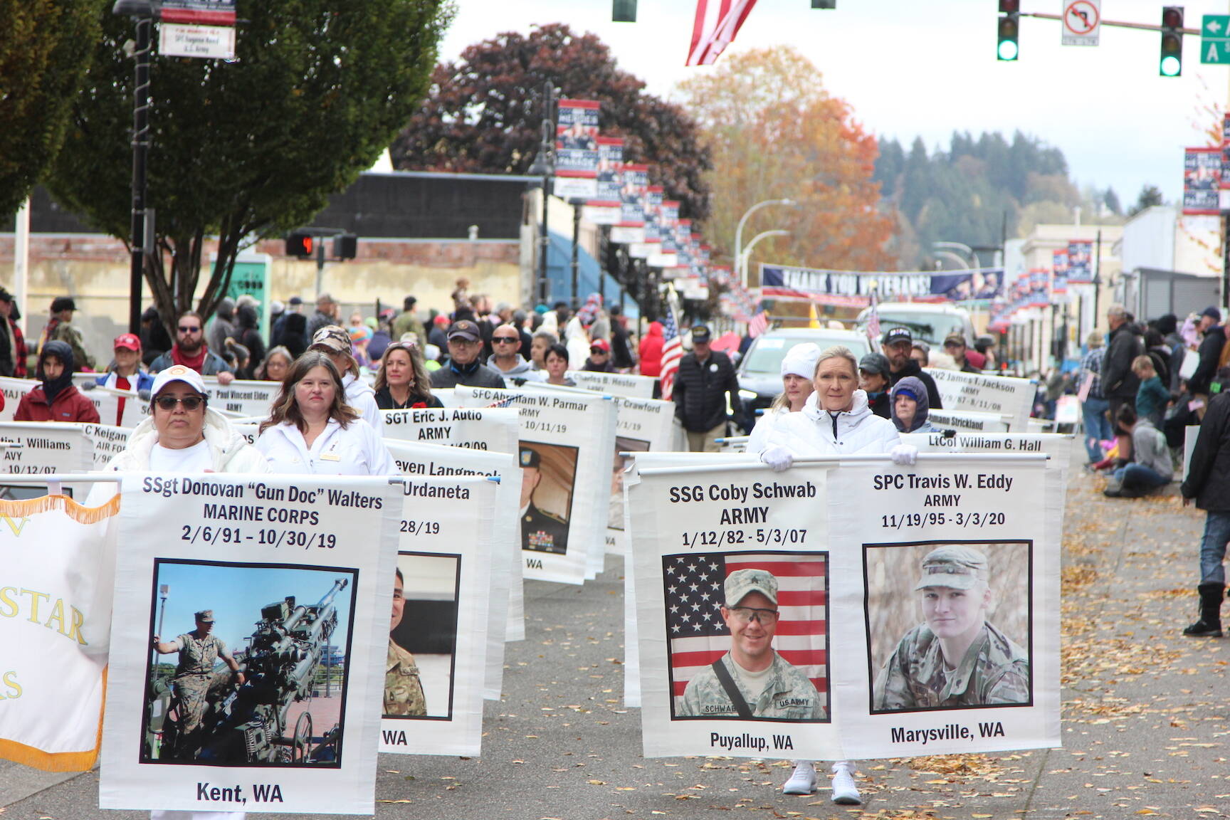 Photo by Kristy Pachciarz, City of Auburn
At the 2022 Veterans Parade and Observance, marchers display the images and names of veterans who gave the “last, full measure of devotion” to their nation in battle.