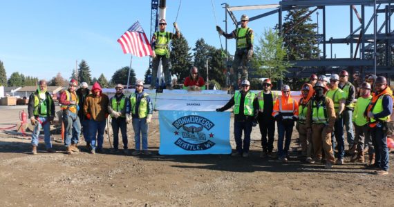 Iron Workers Local Union #86 with the topping out beam Nov. 15 at Terminal Park Elementary School in Auburn. Courtesy photo