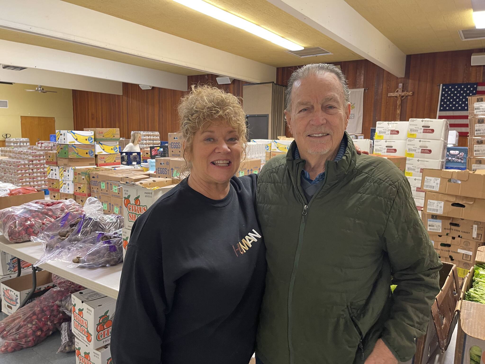 Auburn Mayor Nancy Backus and volunteer Carl Johnson at the Auburn Food Bank on Nov. 23. Photo by Carol Greiling/Auburn Reporter