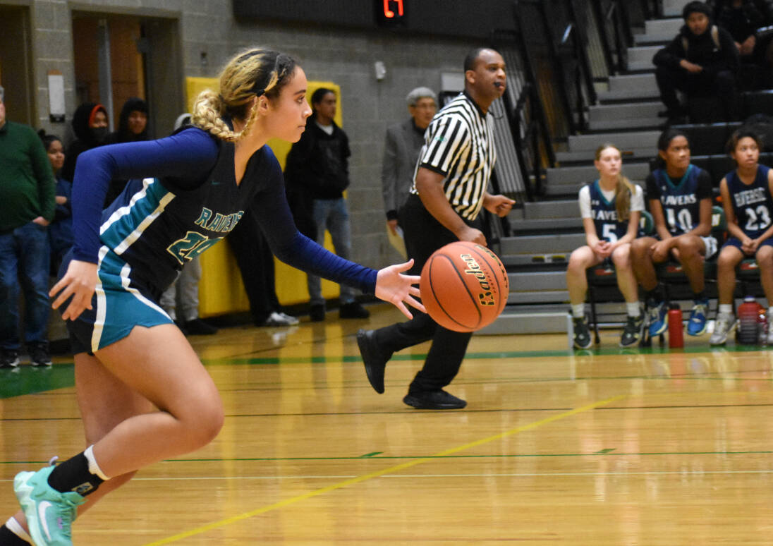 Ravens junior Avery Moore leads Auburn Riverside down the floor.