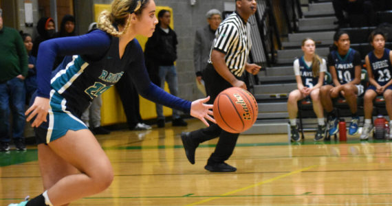 Ravens junior Avery Moore leads Auburn Riverside down the floor. Photo by Ben Ray/Sound Publishing