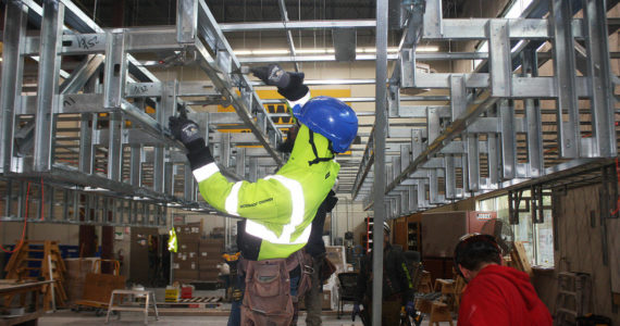 Martinze Johnson takes part in a training program at the Northwest Carpenters Institute of Washington center in Kent. STEVE HUNTER, Sound Publishing