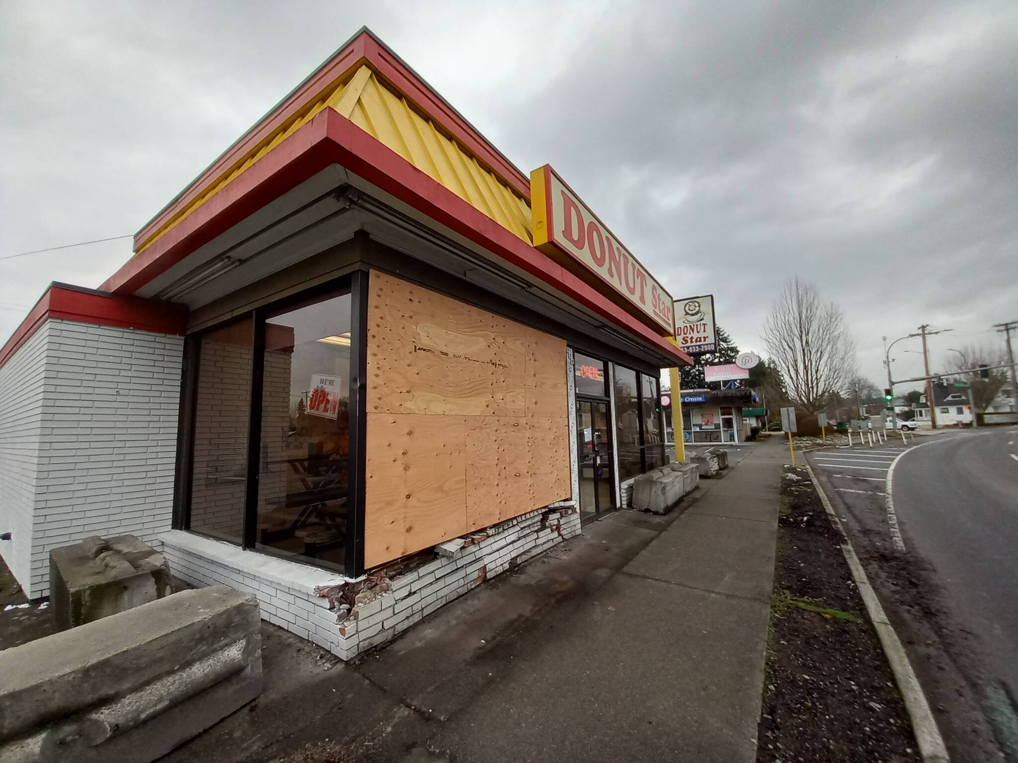 Auburn Police are still looking for the driver of the vehicle that plowed into Donut Star on Dec. 6, the latest of many to do so in the building’s history. Photo by Robert Whale, Auburn Reporter