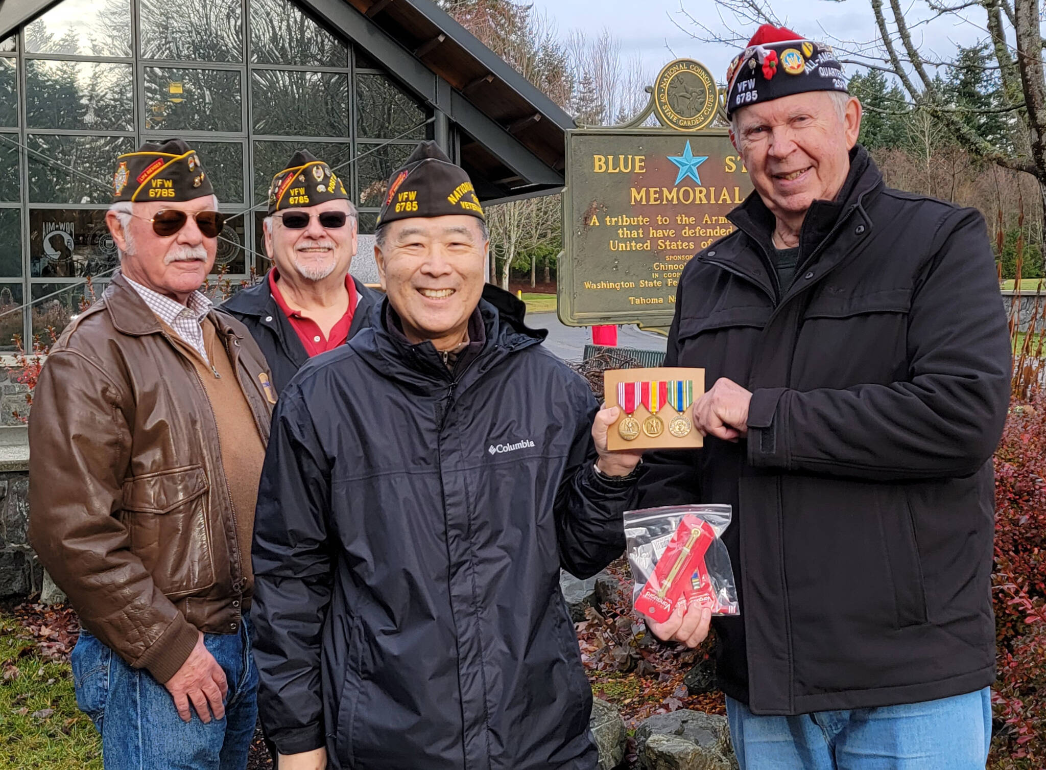 COURTESY PHOTO, VFW Post 6785
From left to right, Alan B’Hymer, USAF Korea Defennse veteran; Richard Klug, USAF Vietnam War veteran; and Walt Tanimoto, US Army Iraq War veteran, honor Richard Sample, US Army Korea Defense veteran, with three awards.