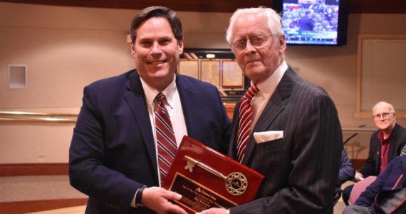 Alex Bruell/The Mirror
Mayor Jim Ferrell, left, presents Bob Roegner with a Key to the City on Jan. 4.