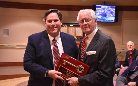 Alex Bruell/The Mirror
Mayor Jim Ferrell, left, presents Bob Roegner with a Key to the City on Jan. 4.