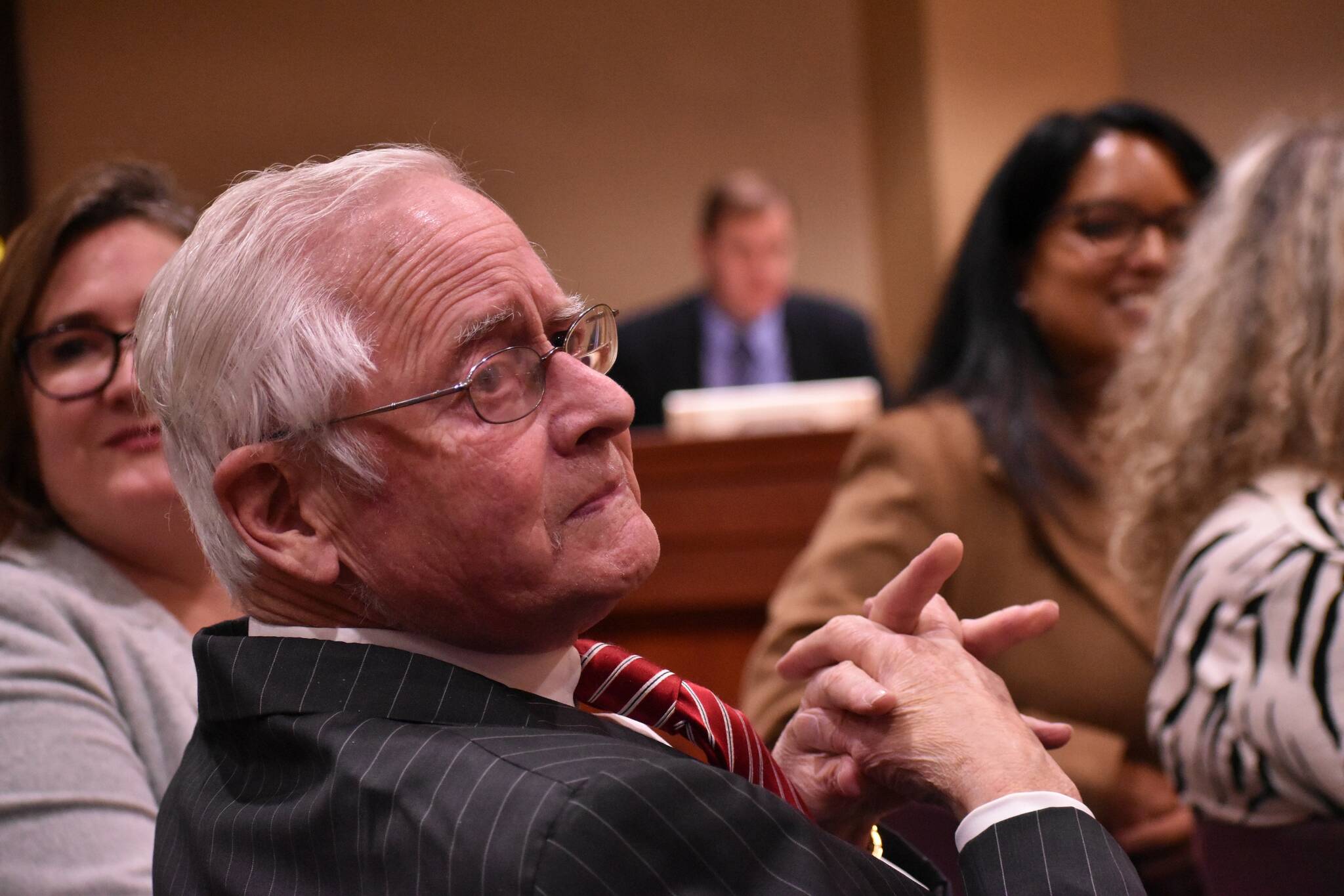 Longtime political columnist Bob Roegner listens as various public officials thank him for his service to South King County, his leadership and his fashion sense. Alex Bruell/The Mirror