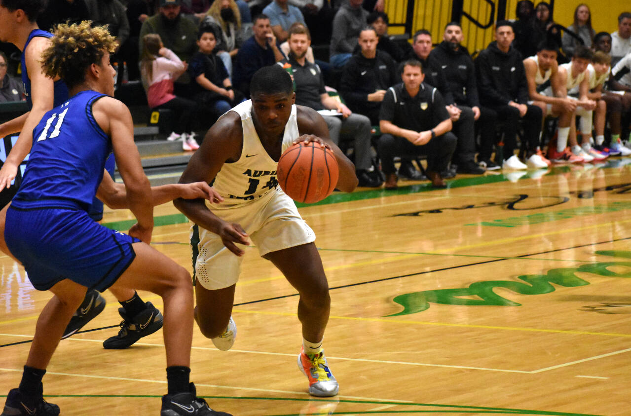 Auburn’s Luvens Valcin driving to the hoop. Photos by Ben Ray/Auburn Reporter