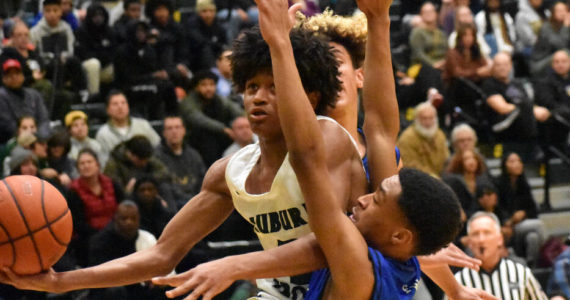Sophomore Jaylen Petty absorbs the contact on his way to the bucket. Photos by Ben Ray/Auburn Reporter