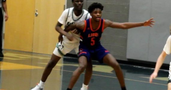 Lion junior Mande Wanlemvo posting up down low against the Titans. Jay O’Neill/ The Reporter