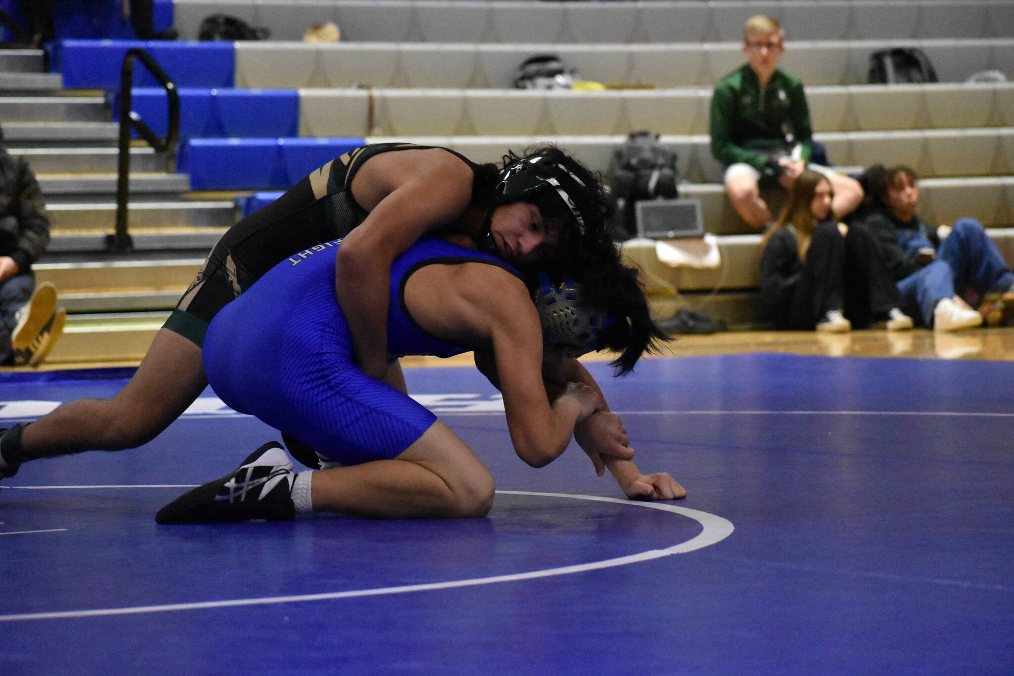 Auburn wrestler working on his Federal Way opponent. Ben Ray/Sound Publishing