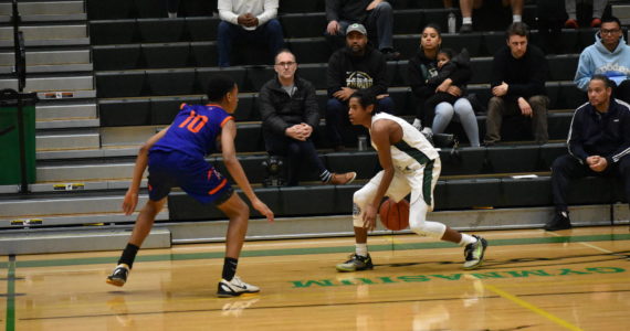 Sophomore Trojan Jaylen Petty takes on a Lion defender. Photos by Ben Ray/The Reporter.