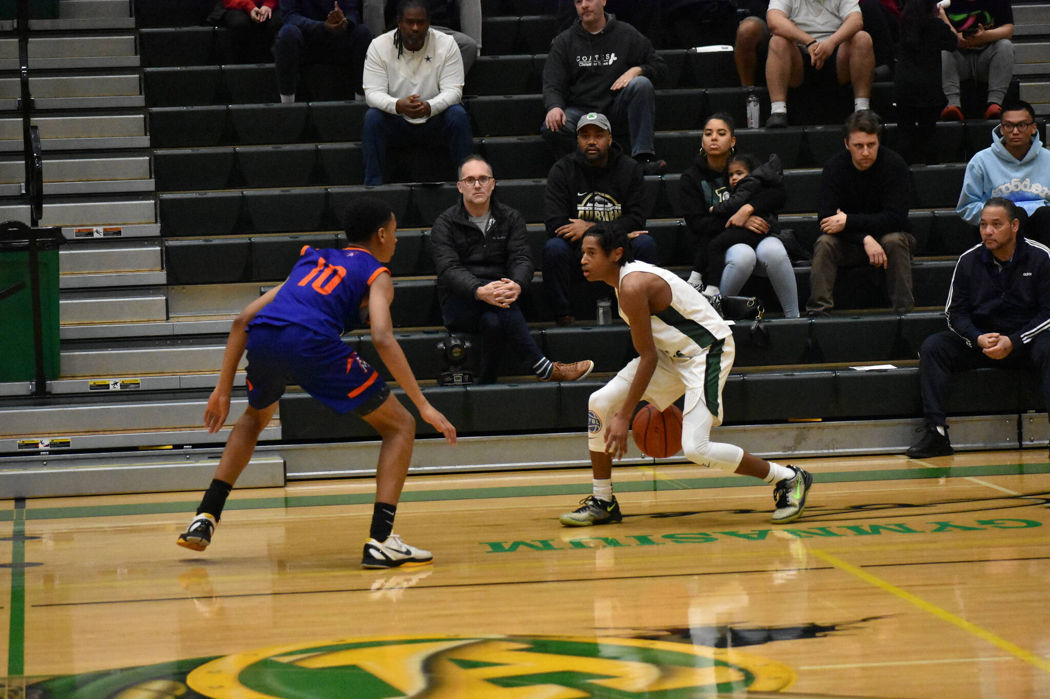 Sophomore Trojan Jaylen Petty takes on a Lion defender. Photos by Ben Ray/The Reporter.