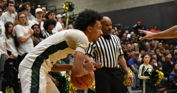 Senior Semaj Brown scopes out the defense against O’Dea. Ben Ray / The Reporter