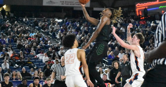 Auburn senior Lateibreon Chandler goes up for a layup inside the Tacoma Dome against Eastside Catholic. Ben Ray / The Reporter