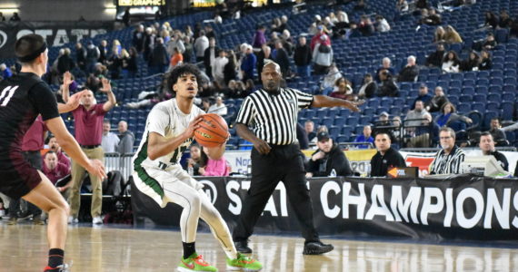 Auburn senior Tyrell Nichols takes a three-pointer. Ben Ray/The Reporter