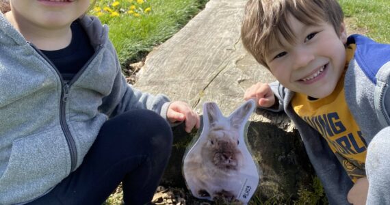 A couple of past participants in the Peter Cotton Trail event smile at their discovery of the elusive bunny. Photo courtesy of Auburn Parks, Arts and Recreation