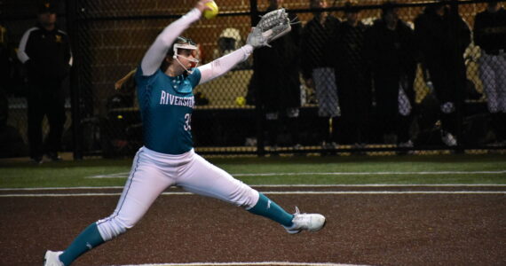 Raven pitcher Lexi Vircks pitches in the Riverside season opener. Ben Ray / The Reporter