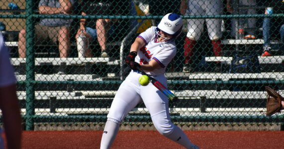 Auburn Mountainview’s Lila McBee makes contact out front with a pitch against Evergreen. Ben Ray / The Reporter