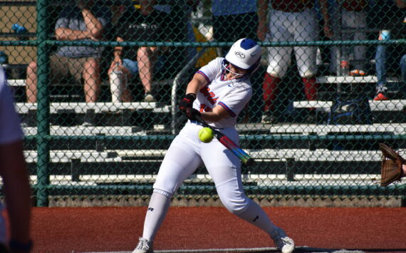 Auburn Mountainview’s Lila McBee makes contact out front with a pitch against Evergreen. Ben Ray / The Reporter