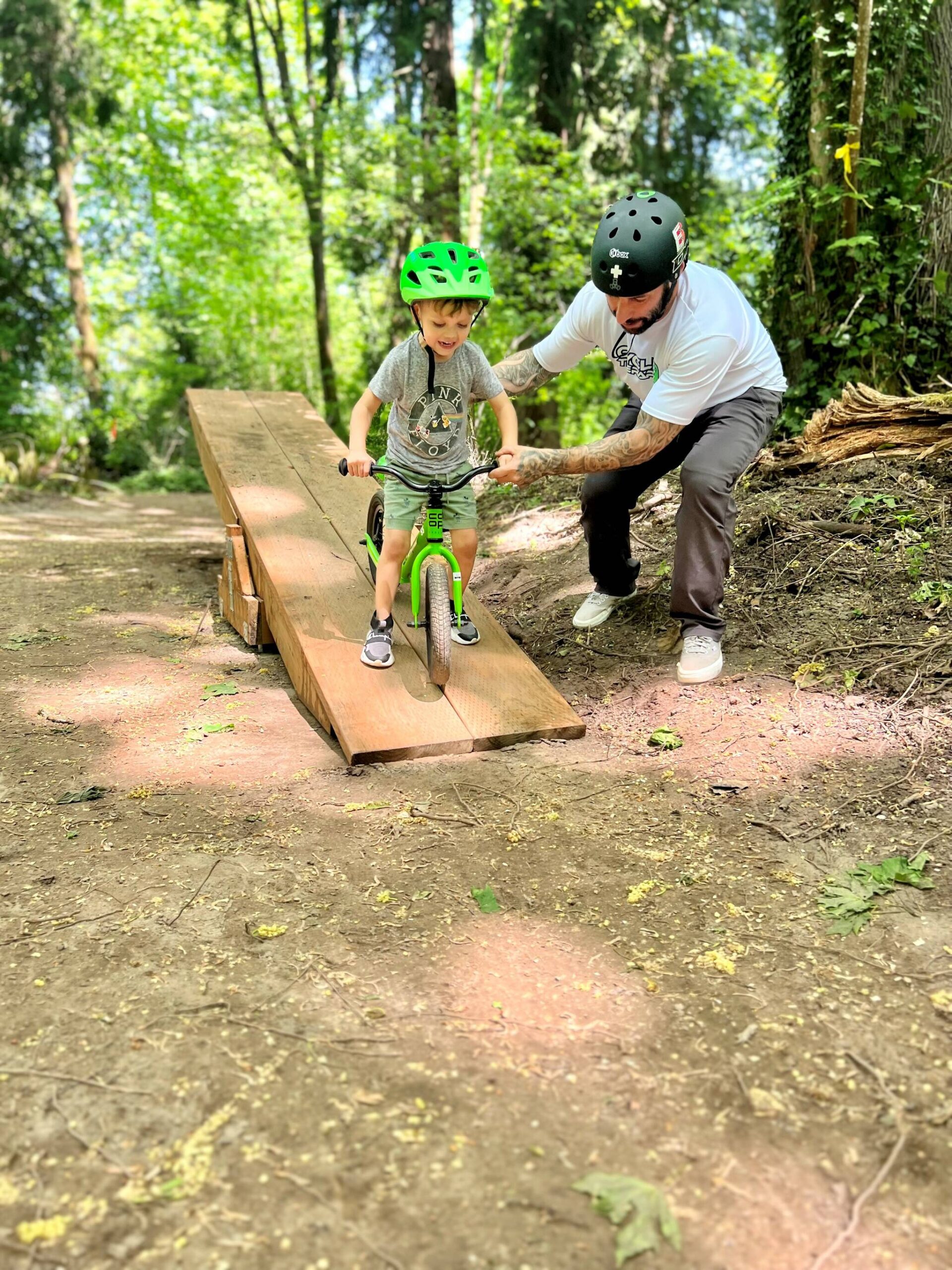 Boy trying out the teeter-totter feature at Cedar Lanes bike park. (Photo courtesy of Auburn Parks, Arts and Recreation)
