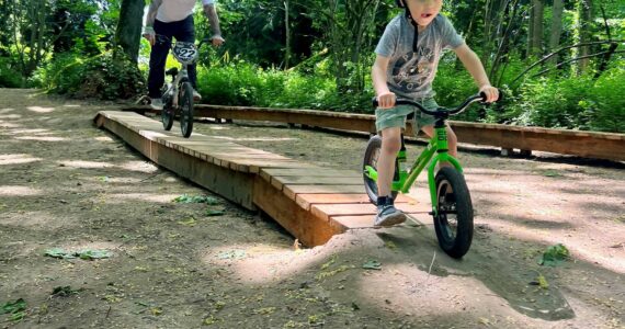 A small boy samples a portion of the bike trail at Cedar Lanes Park in south Auburn. (Photo courtesy of Auburn Parks, Arts and Recreation)