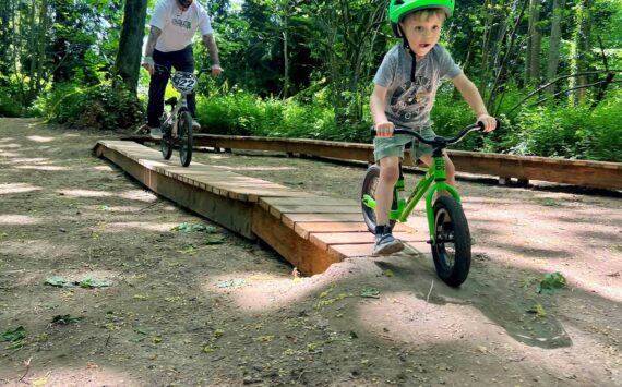 A small boy samples a portion of the bike trail at Cedar Lanes Park in south Auburn. (Photo courtesy of Auburn Parks, Arts and Recreation)